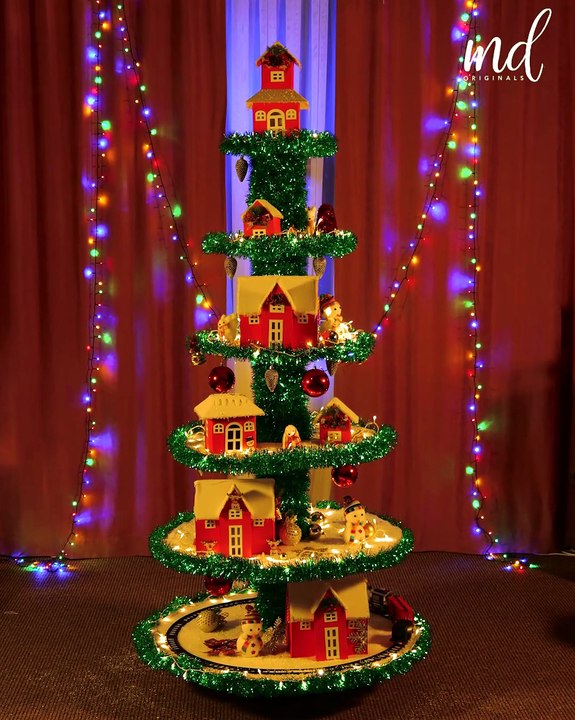 Christmas tree with a miniature village inside 🎄🌟
