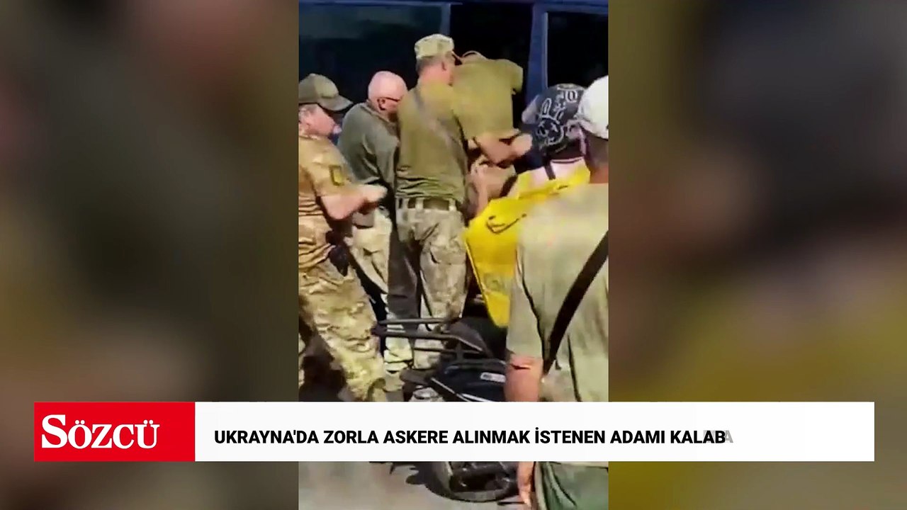 Ukrayna'da zorla askere alınmak istenen adamı kalabalık kurtardı