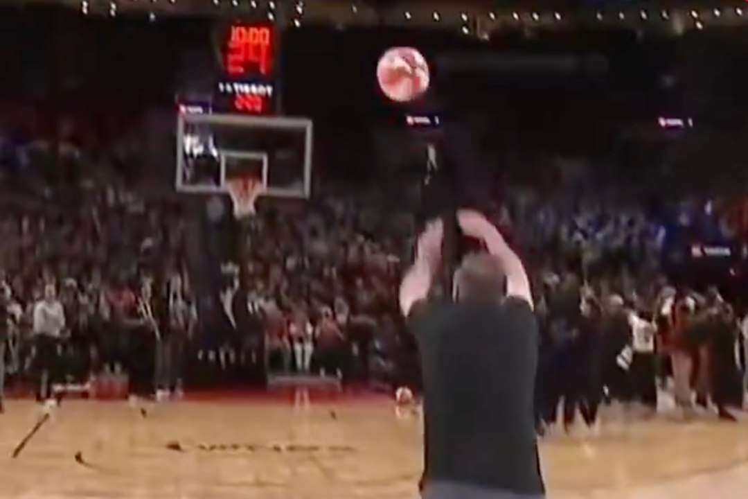 Fan's half-court shot attempt ends with an unforgettable fall