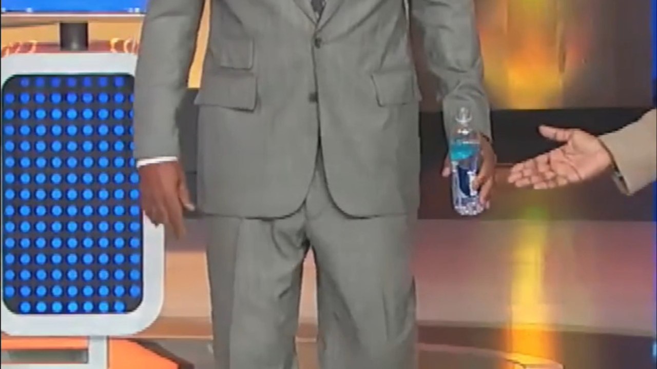 Steve Harvey Watches a Battle Erupt on the Family Feud Stage