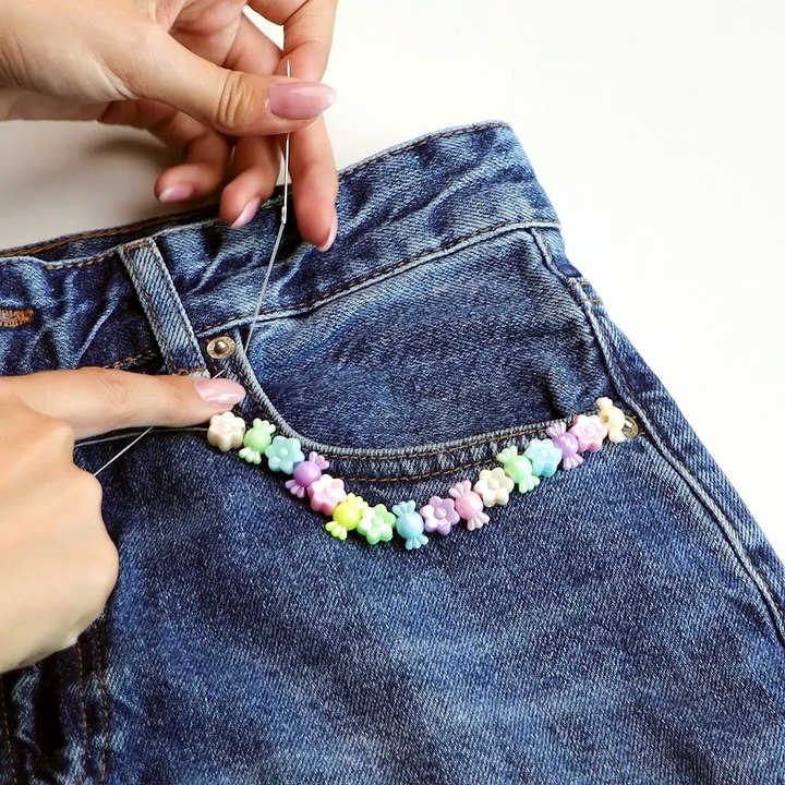 Embroidering beads to your jeans is the new trend💓