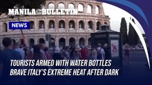 Tourists armed with water bottles brave Italy’s extreme heat after dark