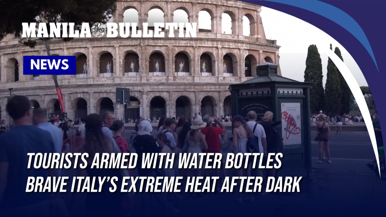 Tourists armed with water bottles brave Italy’s extreme heat after dark