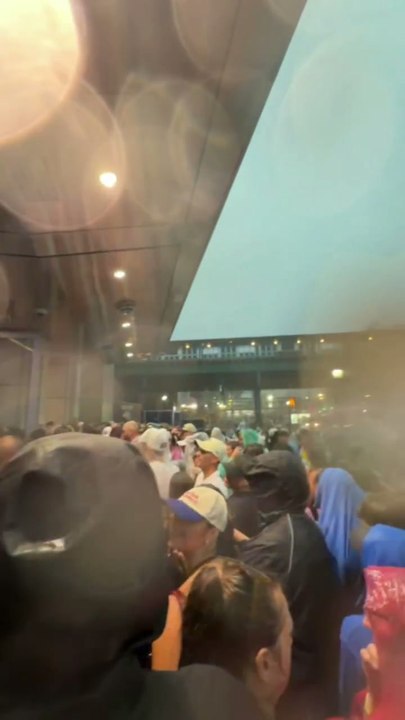 Yankee fans brave the elements getting into tonight’s game.
