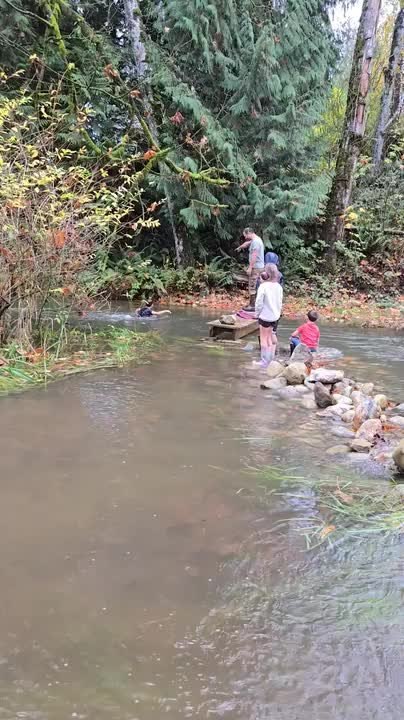 Dad Falls Face First Into Stream After Following Son Jumping Into Water