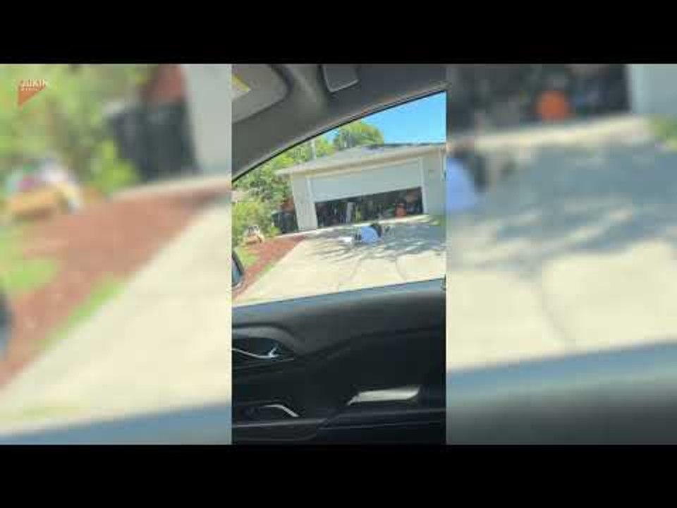 Woman Falls While Running Out of Closing Garage