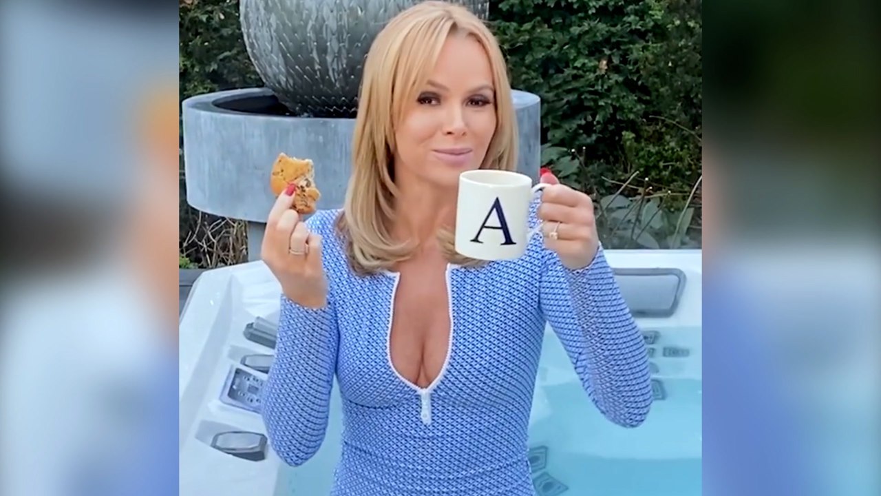 Amanda Holden wows in plunging swimsuit in her...