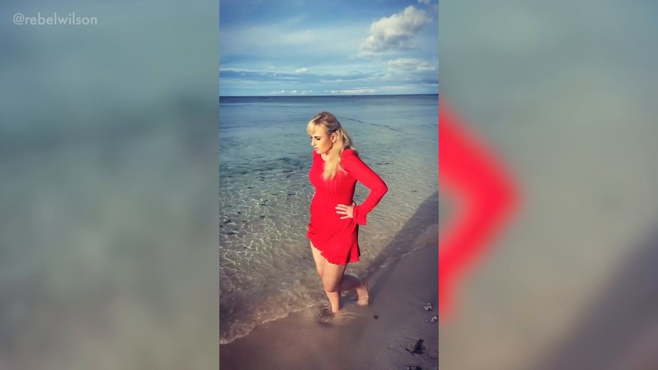 Rebel Wilson stuns in Fiji beach wearing flirty red dress