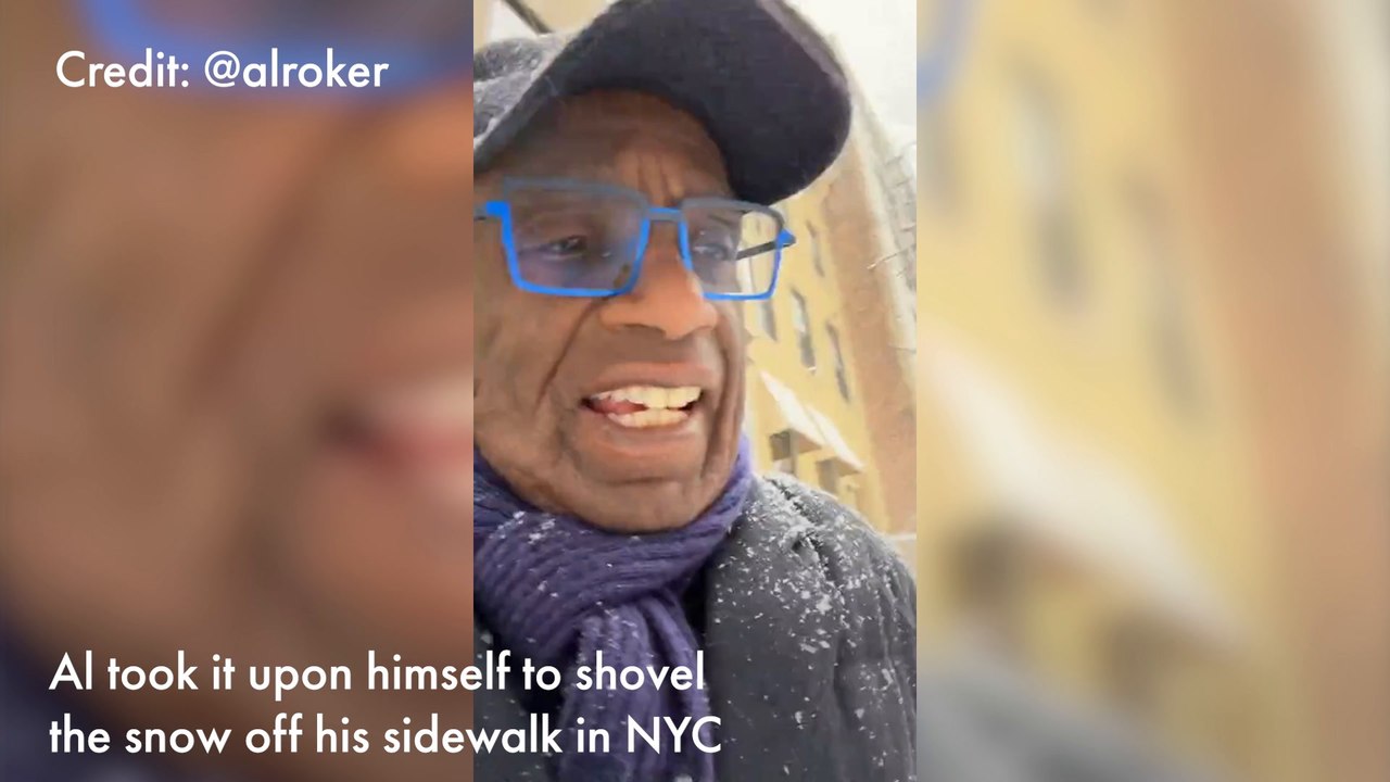 Al Roker shovels the snow outside his home duri...
