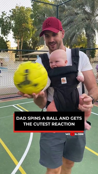 Heartwarming Moment: Baby Giggles as Dad Spins Ball at Park