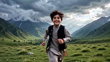 The boy is running in the meadow