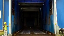 What is the long-term maintenance cost comparison between high speed doors and overhead doors?