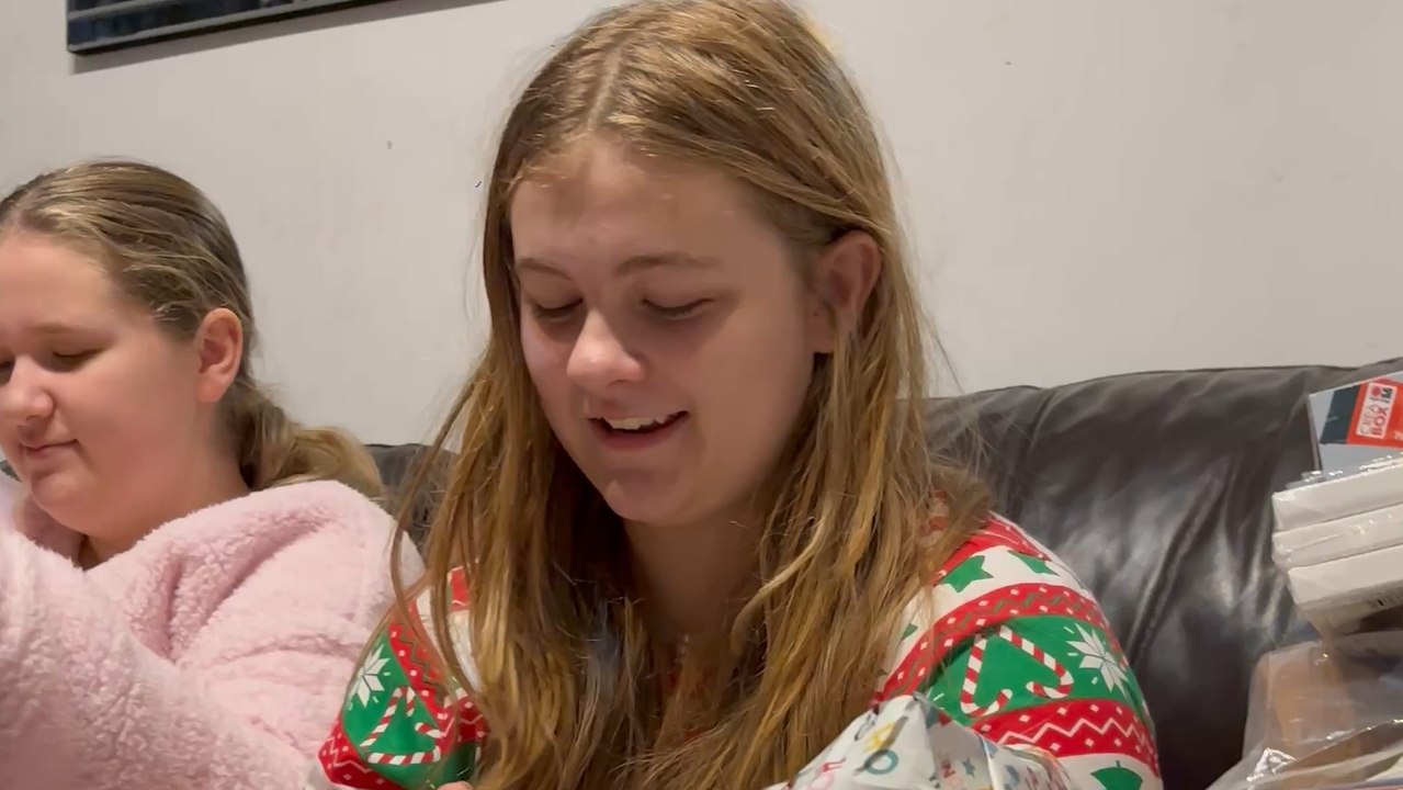 Child astonished by the unexpected holiday gift she received