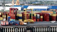 How does free trade tend to benefit society