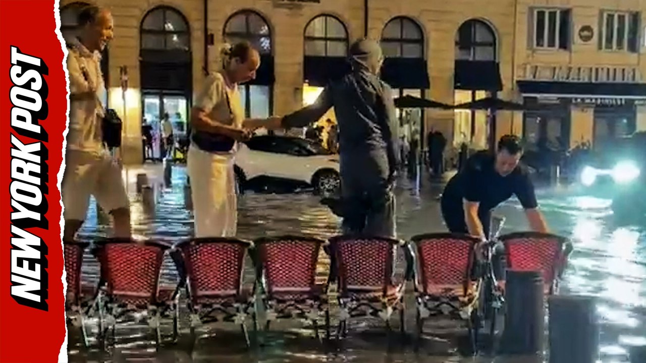 Man's Creative Chair Bridge Helps People Cross Flooded French Street