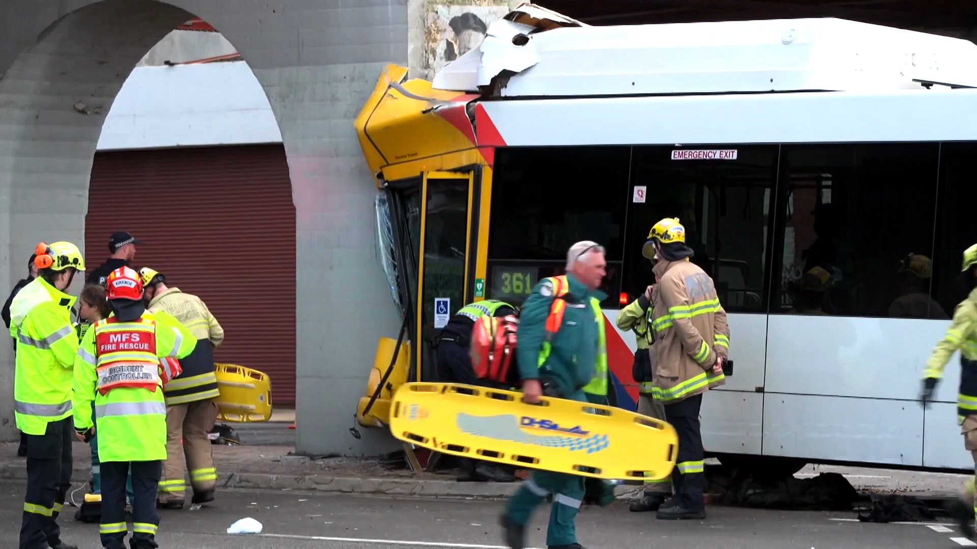 Driver, passenger trapped as bus crashes into train bridge at Port Adelaide