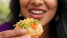 Pirya_biting_crispy_Sev_Puri