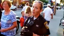 A FEMALE POLICE OFFICER SAID SHE WOULD HIT HIM IN THE FACE BECAUSE HE TOOK A PHOTO
