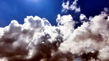 Clouds Drifting Across the Bright Blue Sky