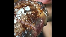Pirya_biting_Juicy Tomahawk Steak