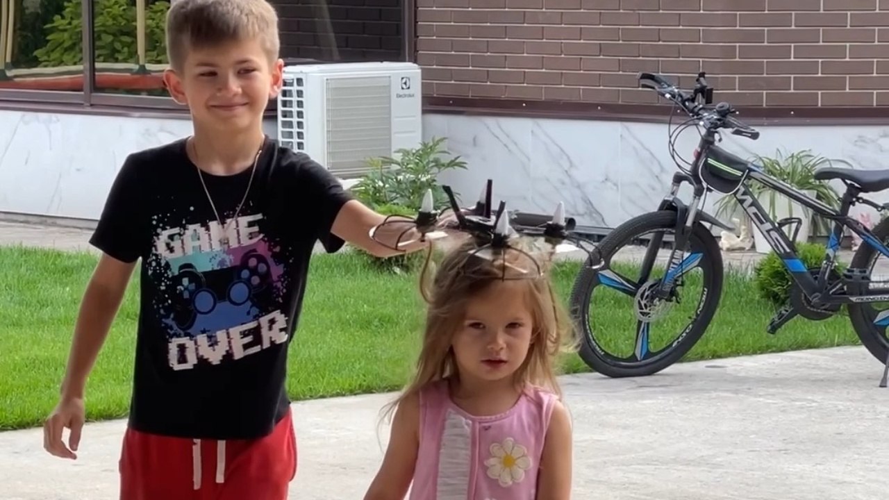 Flying Drone Lands On A Little Girl's Head