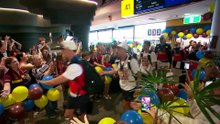 Lions arrive in Brisbane after grand final win