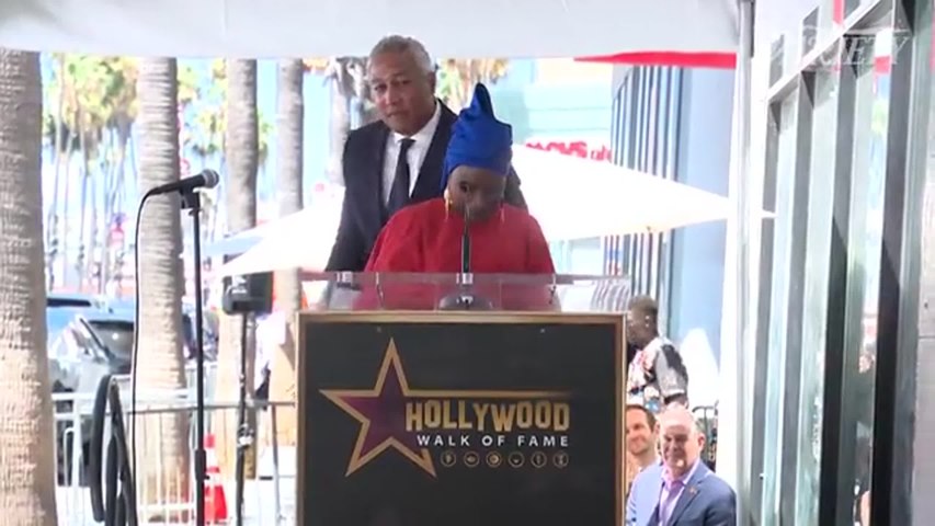 Angélique Kidjo speaks and sings during her Hollywood Walk of Fame ceremony