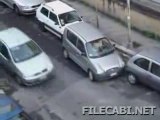 An Italian or Spanish Woman trying to Parallel Park
