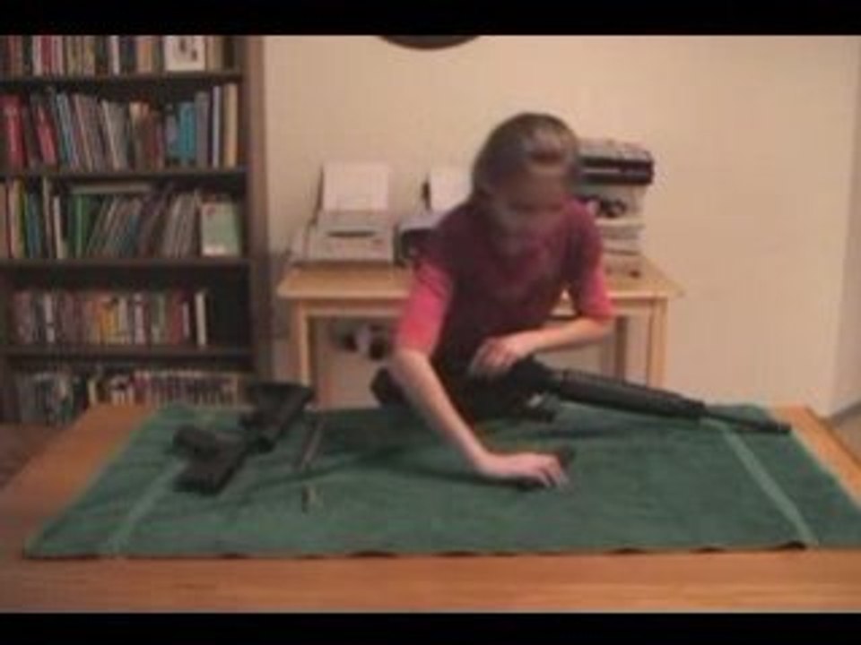 A girl checks out the gun
