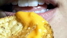 Pirya_biting_cheesy_potato_chip