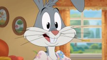 Buster Bunny in a maternity dress with light pink and blue flowers at the house.