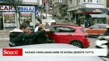 Otomobilin çarptığı anne ile kızına çevredekiler şemsiye tuttu