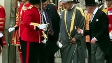 King Charles offers umbrella to Sultan of Oman