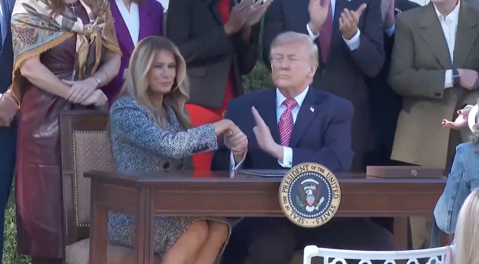 Donald and Melania Trump's awkward kissing moment in front of cameras goes viral