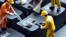 tiny workers prepair keyboard