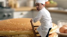 Tiny chef flips large pancake