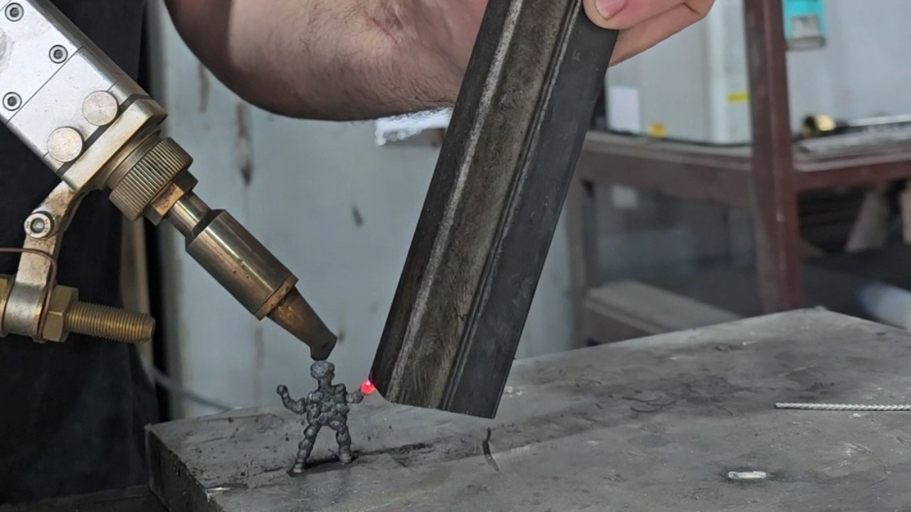 Tiny Welded Figurine Holds Giant Heavy Hammer In One Hand - video ...
