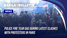Police fire tear gas during latest clashes with protesters in Paris