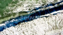 Aerial View of Powerful Waves Crashing on Beach