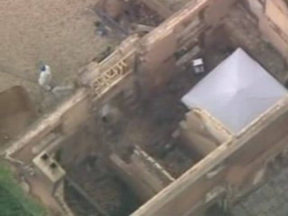 Third body found in mansion ruins