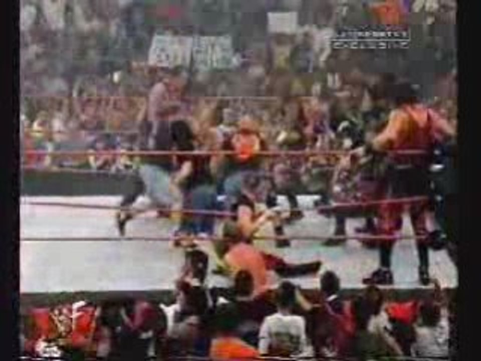 Wwe stone cold comes out to save team wwf