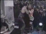 WWE - Undertaker Chokeslams RVD Off The stage And Through Tw