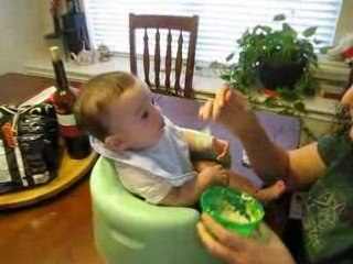 Benjamin eating avocado - first fruit! - Sept. 14 2008