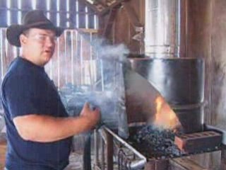 Blacksmith Starting A Coal Forge Fire