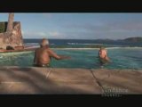 Richard Branson teaches Desmond Tutu how to swim