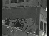 Graffiti-2 Boys  Spraying  on rooftop -action at night - Be