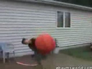 Kid Gets Rocked by Huge Orange Ball