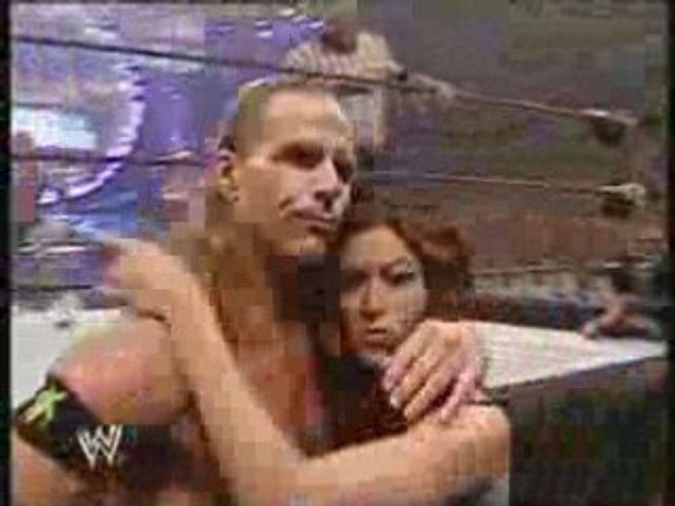 Shawn micheals puts his arm round melina
