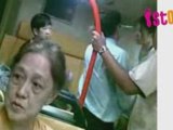 Two Middle Aged Women Fighting over a seat in bus 88