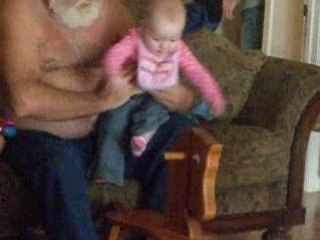 Mia riding Abby's  wooden horse